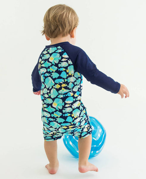 RuffleButts + RuggedButts - Baby Boys Fish Friends Long Sleeve One Piece Rash Guard Swimsuit: Navy / 12-18m