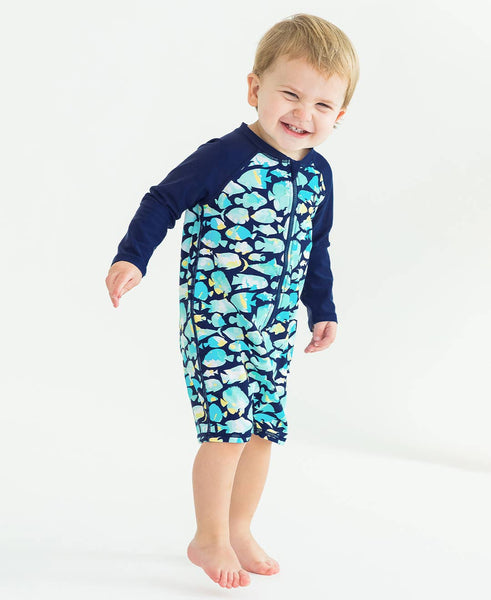 RuffleButts + RuggedButts - Baby Boys Fish Friends Long Sleeve One Piece Rash Guard Swimsuit: Navy / 12-18m